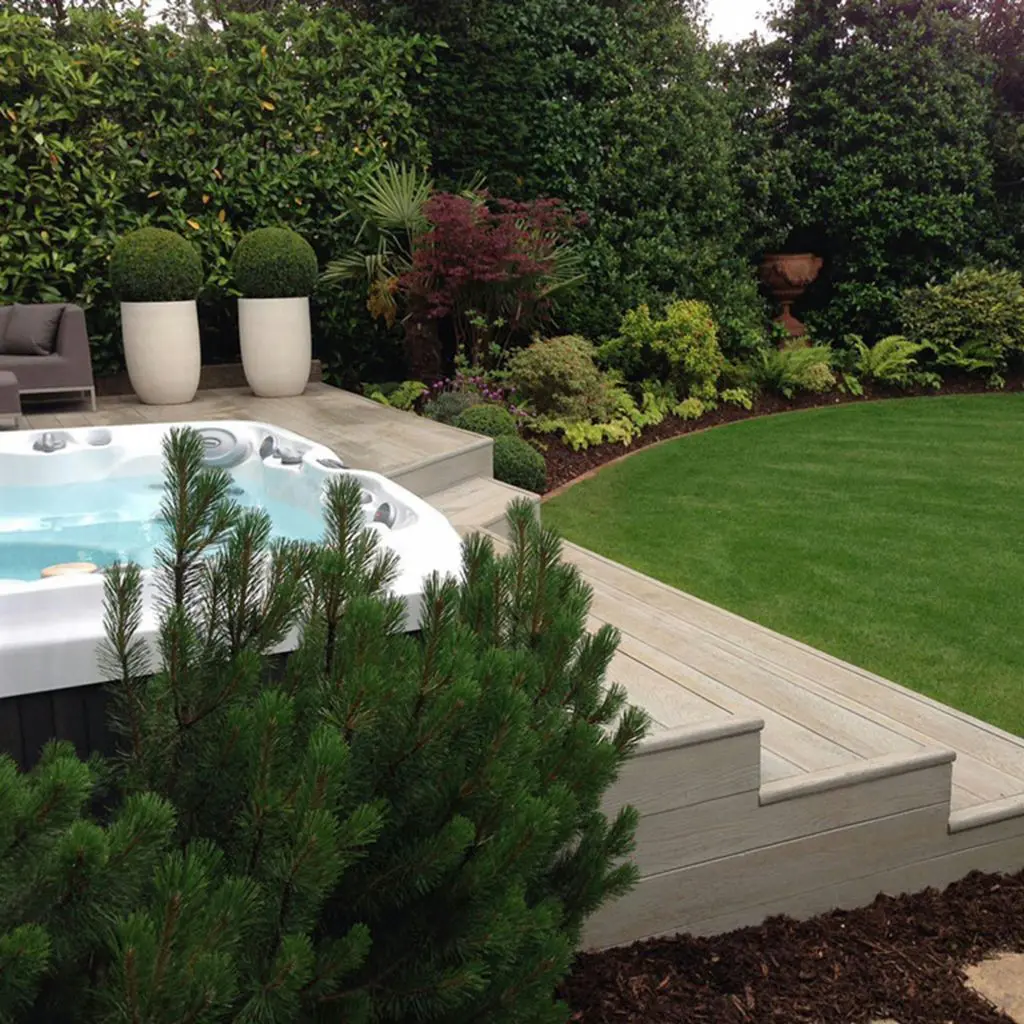 hot tub in a well landscaped garden for relaxation